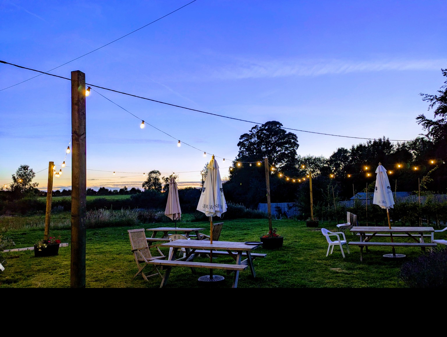 Garden seating overlooking the grounds at Elderbrook House.