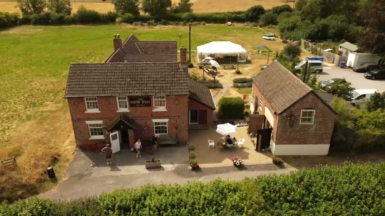 Aerial view of Elderbrook House, The New Inn, the garden and the surrounding Wiltshire fields.